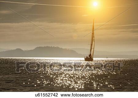 Stock Image - Yacht sailing on Lake Maggiore, Piemonte, Novara, Italy. Fotosearch