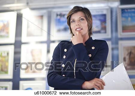 Young businesswoman in office View Large Photo Image Stock Image - Young businesswoman in office. Fotosearch