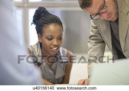 Young businesswoman presenting ideas in meeting View Large Photo Image Stock Image - Young businesswoman presenting ideas in meeting. Fotosearch