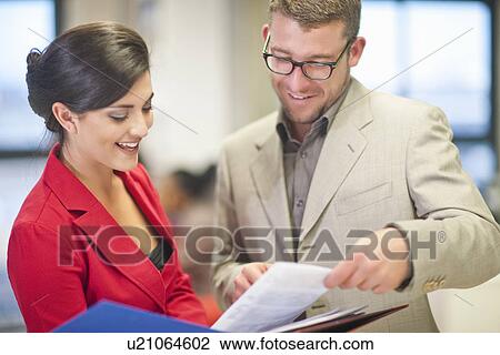 Young businesswoman presenting ideas to colleague View Large Photo Image Stock Image - Young businesswoman presenting ideas to colleague. Fotosearch