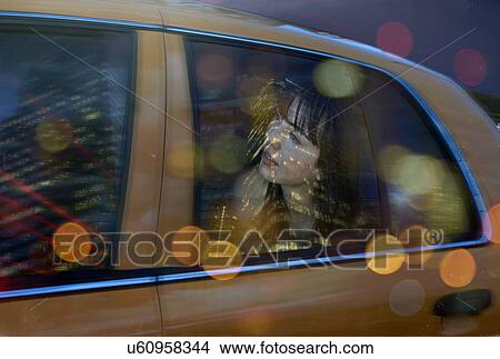 Young woman in back of taxi View Large Photo Image Picture - Young woman in back of taxi. Fotosearch