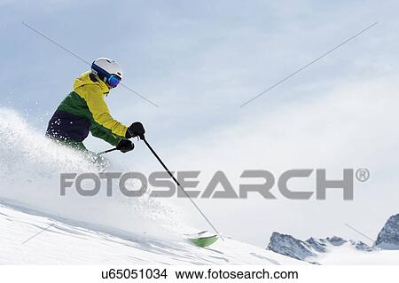 Young woman skiing downhill, Obergurgl, Austria View Large Photo Image Picture - Young woman skiing downhill, Obergurgl, Austria. Fotosearch