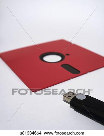 Picture - Flash drive and floppy disk. Fotosearch