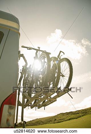 Stock Image - Bikes on back of camper van. Fotosearch
