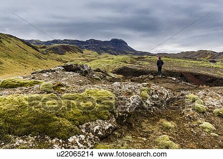 Picture - Boy gazing over volcanic landscape, Nesjavellir, Iceland. Fotosearch