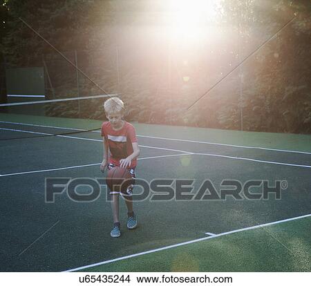 Picture - Boy playing basketball. Fotosearch