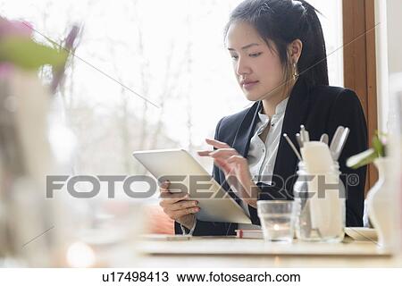 Business woman using digital tablet View Large Photo Image Stock Image - Business woman using digital tablet. Fotosearch