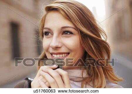 Close up of attractive young woman with smartphone View Large Photo Image Stock Image - Close up of attractive young woman with smartphone. Fotosearch