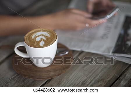 Close up of young woman using cellphone in cafe View Large Photo Image Stock Image - Close up of young woman using cellphone in cafe. Fotosearch