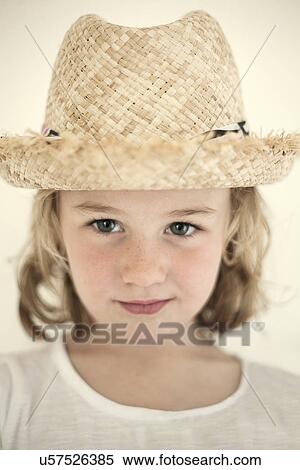 Close up portrait of female toddler in straw hat View Large Photo Image Stock Photography - Close up portrait of female toddler in straw hat. Fotosearch