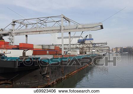 Container crane and freight containers in river port View Large Photo Image Stock Photograph - Container crane and freight containers in river port. Fotosearch