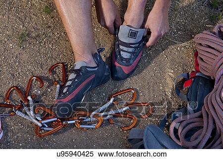 Cropped shot of young male climber putting on trainers View Large Photo Image Stock Photography - Cropped shot of young male climber putting on trainers. Fotosearch