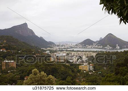 Distant view of Christ the Redeemer and Rio De Janeiro, Brazil View Large Photo Image Stock Photography - Distant view of Christ the Redeemer and Rio De Janeiro, Brazil. Fotosearch