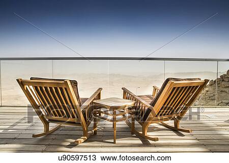 Empty deckchairs on wooden deck, Ramon Crater, Negev Desert, Israel View Large Photo Image Stock Image - Empty deckchairs on wooden deck, Ramon Crater, Negev Desert, Israel. Fotosearch