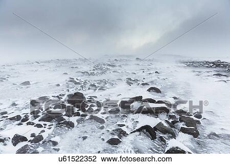 Stock Image - Frozen glacial landscape with rocks, langjokull, Iceland. Fotosearch