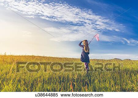 Girl carrying butterfly net in spring meadows, Reykjavic, Iceland View Large Photo Image Stock Photography - Girl carrying butterfly net in spring meadows, Reykjavic, Iceland. Fotosearch