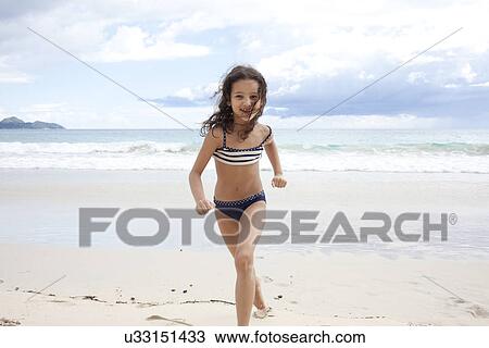 Girl running on beach in Seychelles View Large Photo Image Stock Image - Girl running on beach in Seychelles. Fotosearch