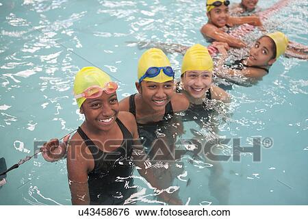 Group of schoolgirls taking a break in swimming pool View Large Photo Image Stock Photograph - Group of schoolgirls taking a break in swimming pool. Fotosearch