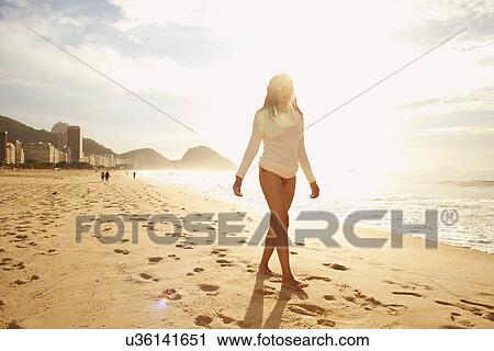 Mature woman strolling on sunlit Copacabana beach, Rio De Janeiro, Brazil View Large Photo Image Stock Image - Mature woman strolling on sunlit Copacabana beach, Rio De Janeiro, Brazil. Fotosearch