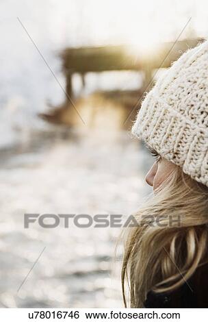 Stock Photograph - Mid adult woman in snow. Fotosearch