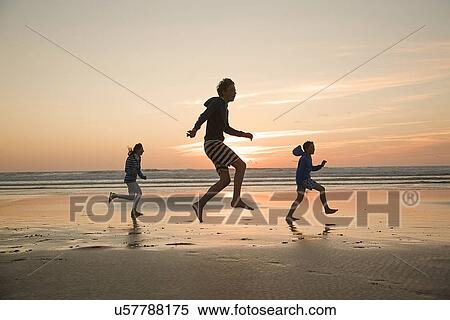 Mother and sons running on beach View Large Photo Image Stock Photography - Mother and sons running on beach. Fotosearch
