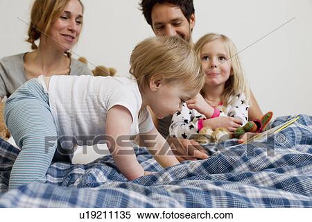 One year old baby girl crawling on parents bed View Large Photo Image Stock Photography - One year old baby girl crawling on parents bed. Fotosearch