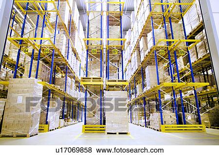 Stock Photo - Pallets and shelves in distribution warehouse. Fotosearch