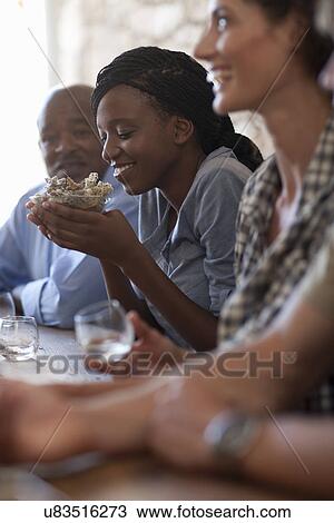 People sitting around table, tasting drinks View Large Photo Image Stock Image - People sitting around table, tasting drinks. Fotosearch