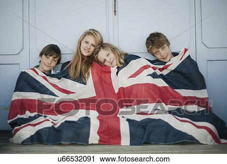Portrait of brothers and sisters sitting on porch wrapped in union jack flag View Large Photo Image Stock Image - Portrait of brothers and sisters sitting on porch wrapped in union jack flag. Fotosearch
