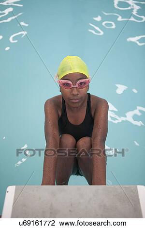 Portrait of confident schoolgirl swimmer poolside View Large Photo Image Stock Image - Portrait of confident schoolgirl swimmer poolside. Fotosearch