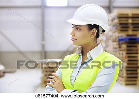 Portrait of female manager in distribution warehouse View Large Photo Image Picture - Portrait of female manager in distribution warehouse. Fotosearch