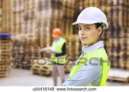 Stock Photo - Portrait of female supervisor in distribution warehouse. Fotosearch
