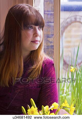 Portrait of girl by window View Large Photo Image Stock Image - Portrait of girl by window. Fotosearch