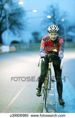Portrait of young female cyclist at velodrome View Large Photo Image Stock Photography - Portrait of young female cyclist at velodrome. Fotosearch