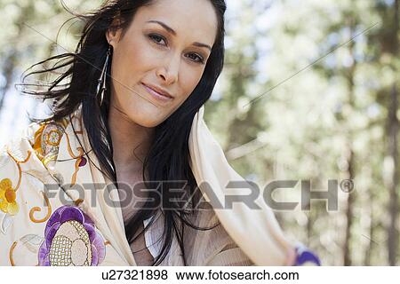 Portrait of young woman in forest View Large Photo Image Stock Photo - Portrait of young woman in forest. Fotosearch