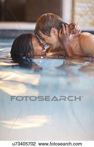 Romantic young couple in spa swimming pool View Large Photo Image Stock Image - Romantic young couple in spa swimming pool. Fotosearch