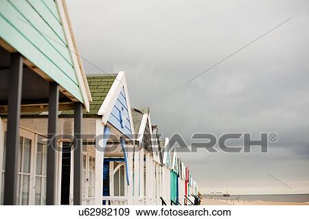 Row of beach huts, Southwold, Sussex, UK View Large Photo Image Stock Photo - Row of beach huts, Southwold, Sussex, UK. Fotosearch