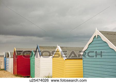 Row of multi colored beach huts, Southwold, Sussex, UK View Large Photo Image Stock Photograph - Row of multi colored beach huts, Southwold, Sussex, UK. Fotosearch