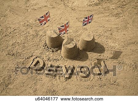 Stock Photo - Sandcastles with british flags and Devon. Fotosearch