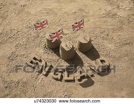 Stock Image - Sandcastles with british flags and England. Fotosearch