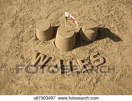 Stock Photo - Sandcastles with welsh flag and Wales. Fotosearch