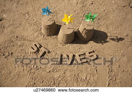 Stock Image - Sandcastles with windmills and St Ives. Fotosearch