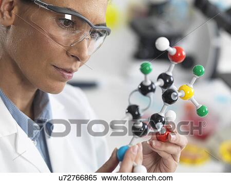 Stock Photography - Scientist viewing a molecular structure in a laboratory. Fotosearch
