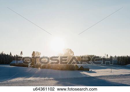 Sun rising over cabins View Large Photo Image Stock Image - Sun rising over cabins. Fotosearch