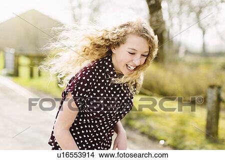 Teenage girl skateboarding on rural road View Large Photo Image Picture - Teenage girl skateboarding on rural road. Fotosearch