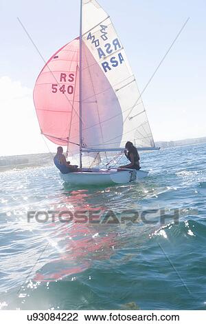 Teenager sailing boat View Large Photo Image Stock Image - Teenager sailing boat. Fotosearch
