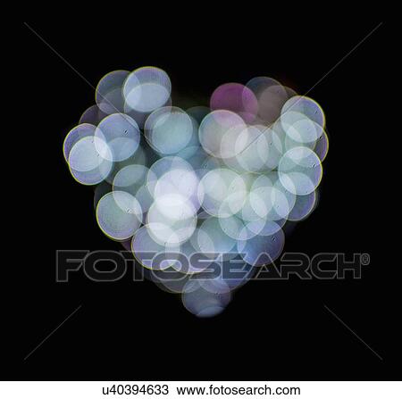 Stock Image - Valentines abstract heart-shaped lights. Fotosearch