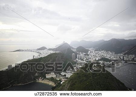 View of Rio De Janeiro coastline from Sugar Loaf Mountain, Brazil View Large Photo Image Stock Photography - View of Rio De Janeiro coastline from Sugar Loaf Mountain, Brazil. Fotosearch