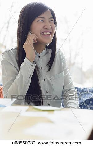 Stock Image - Woman using phone. Fotosearch
