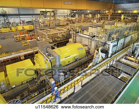 Workers in turbine hall of power station, high angle view View Large Photo Image Stock Photograph - Workers in turbine hall of power station, high angle view. Fotosearch